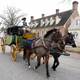 Colonial Williamsburg coachman Collin Ashe drives a coach full of visitors down Duke of Gloucester Street in the restored area Thursday Feb. 24, 2022, in Williamsburg, Va. Colonial Williamsburg has begun to honor the coachmen by naming a new carriage after one of them.
